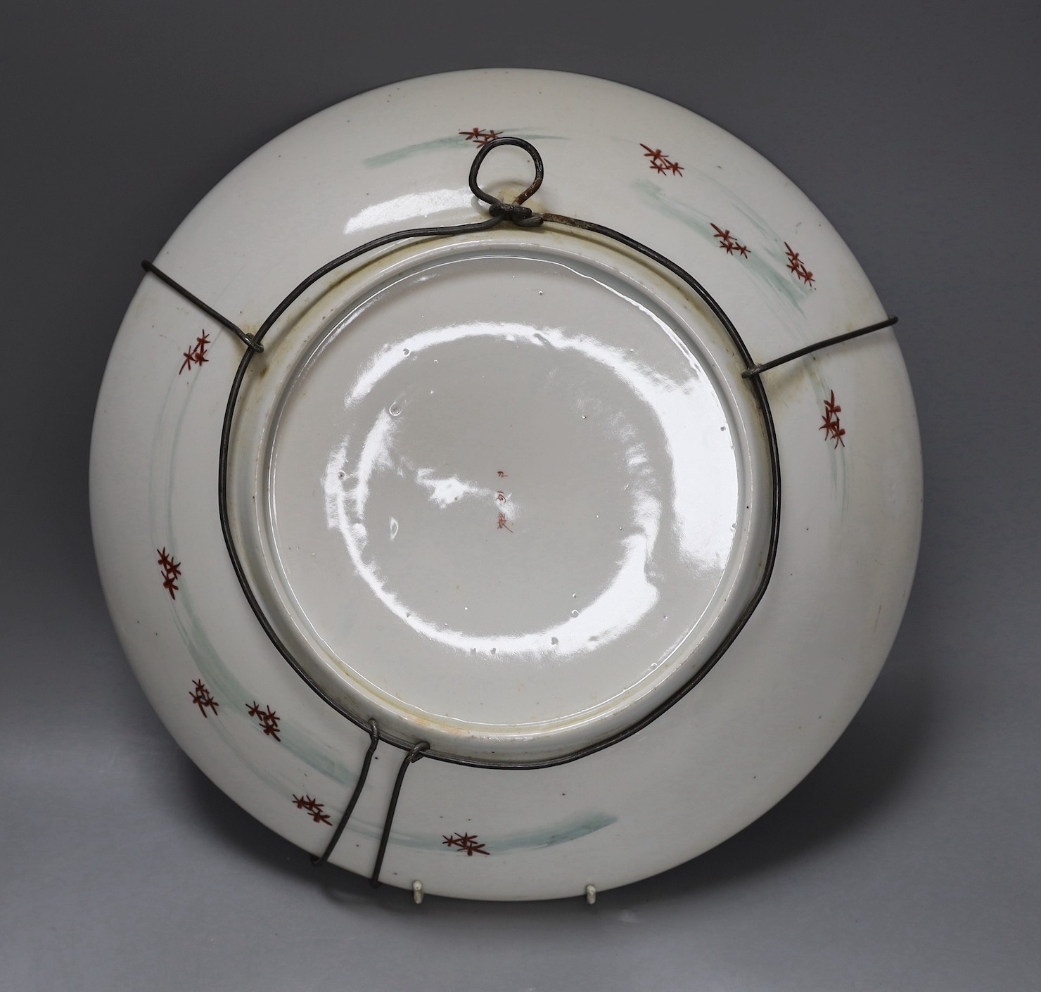 Two Japanese kutani chargers, signed, largest 36 cms diameter